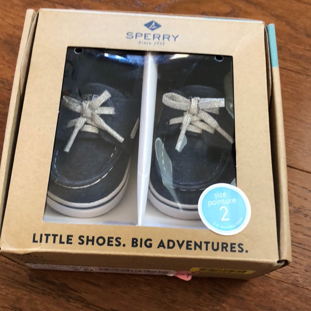 Sperry. Baby shoes.   Will work for either sex